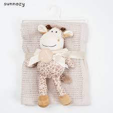 Baby knitted blanket with soft toy